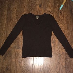 a long sleeve brown shirt.